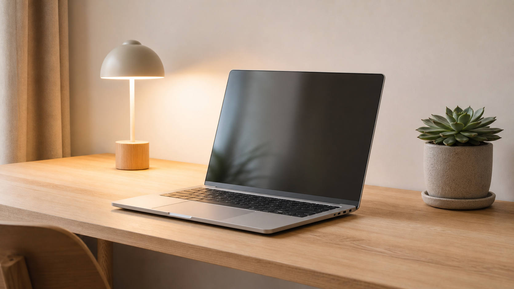 Clean minimal workspace with laptop for focused AI-assisted work